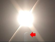 Lens flare shows crescent Sun